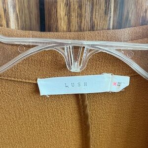 Lush Camel Gold Duster with tab sleeves and front pockets.